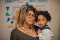 Curly haired boy with his mom